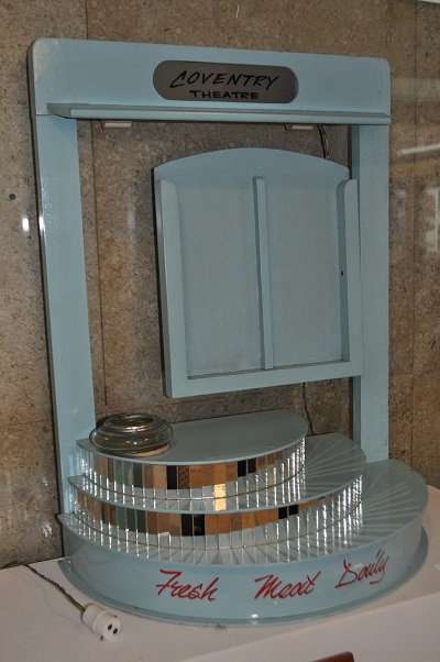 Light blue wooden leaflet stand with mirror tile trim and glass bowl ashtray